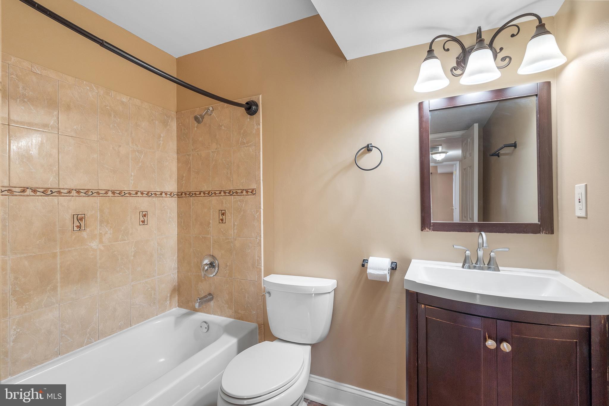 2 Avon Drive Hightstown, NJ 08520 - Photo 9 of 27 a bathroom with a sink a toilet and shower