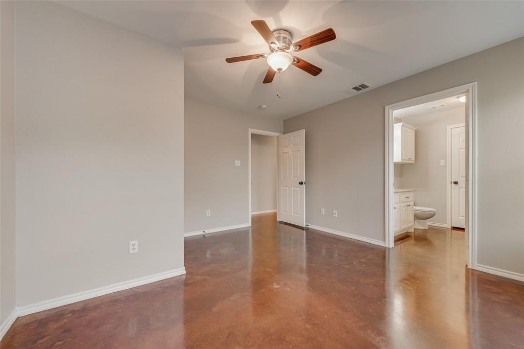 309 East 2nd Street Maypearl, TX 76064 - Photo 11 of 20 an empty room with wooden floor and a ceiling fan