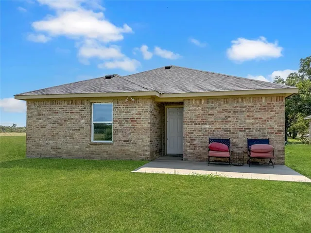 a view of house with outdoor space