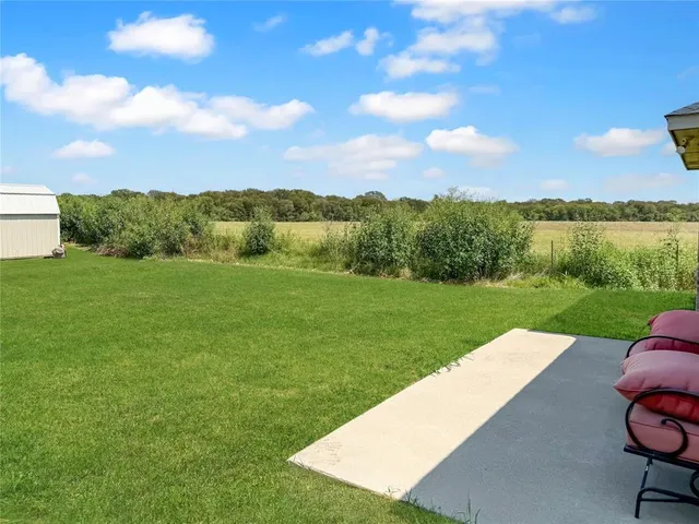 a view of a garden and mountains