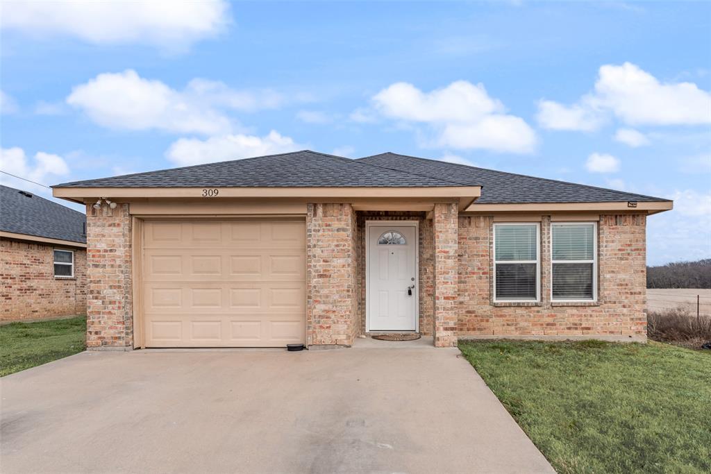 309 East 2nd Street Maypearl, TX 76064 - Photo 2 of 20 front view of a house with a pathway