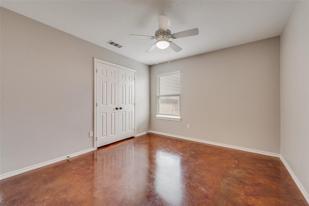 309 East 2nd Street Maypearl, TX 76064 - Photo 8 of 20 a view of an empty room with wooden floor and a window