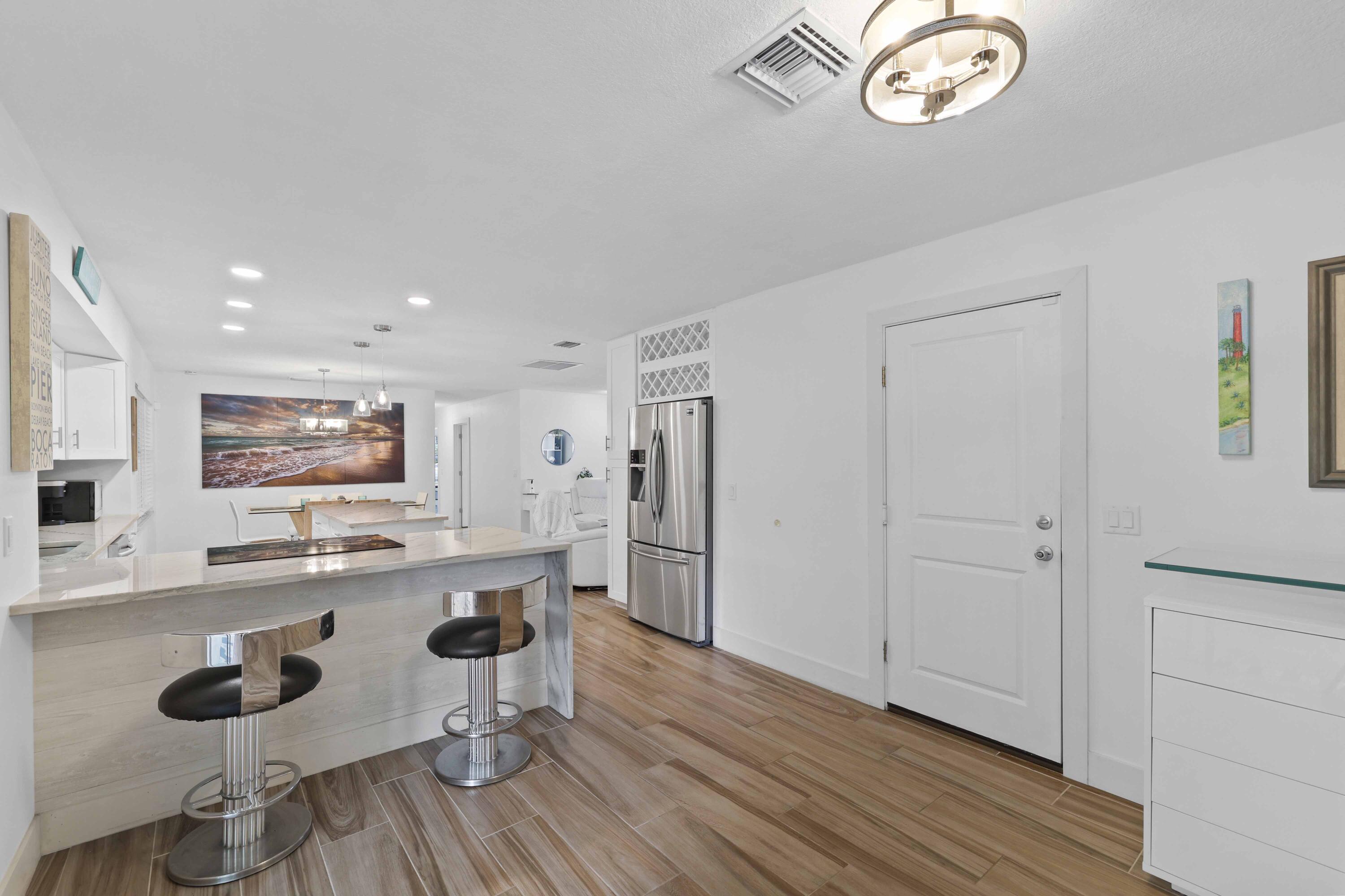 5554 Hibiscus Road Jupiter, FL 33458 - Photo 25 of 66 Kitchen & Garage Door