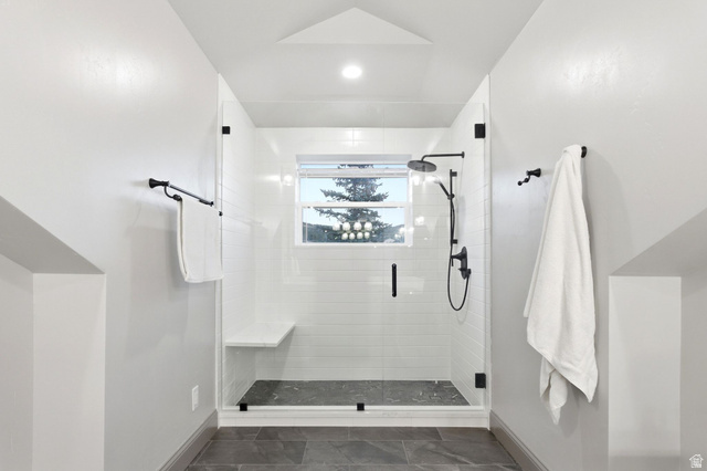 8650 Redden Road Park City, UT 84098 - Photo 27 of 71 Walk-in shower with clear glass enclosure and black hardware
