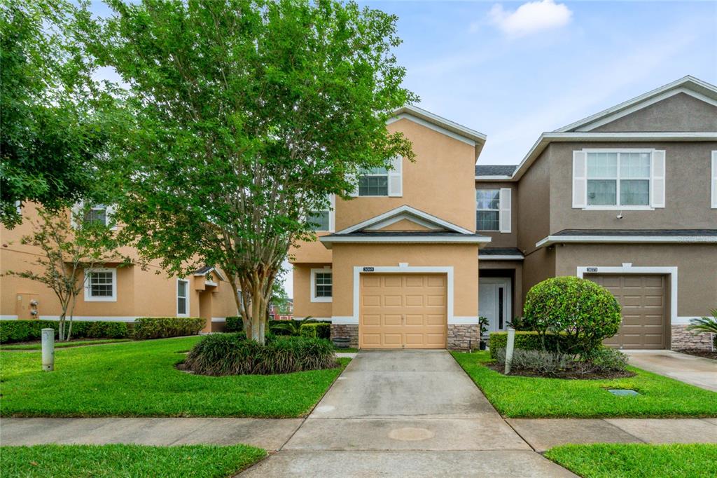 3069 Rodrick Circle Orlando, FL 32824 - Photo 1 of 1 a front view of a house with a yard and garage
