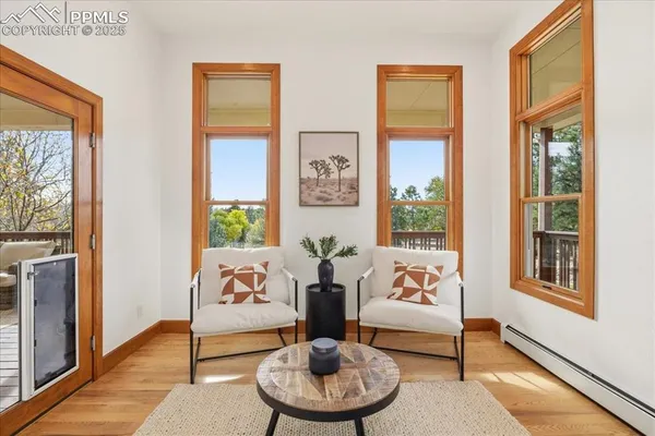 a view of a livingroom with workspace and a couch