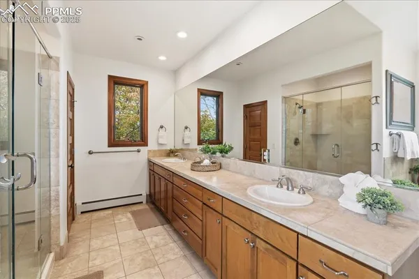 a bathroom with a bathtub and a shower