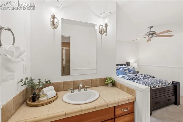 a kitchen with kitchen island granite countertop a table and chairs in it