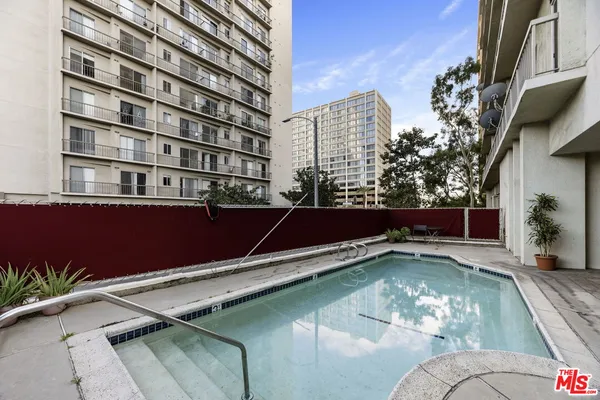 a view of a swimming pool with a lounge chairs