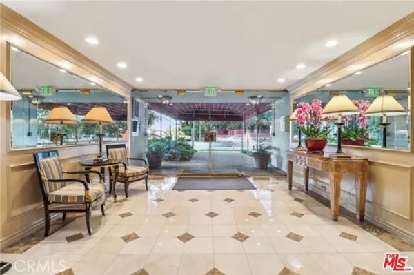a view of a patio with a table and chairs