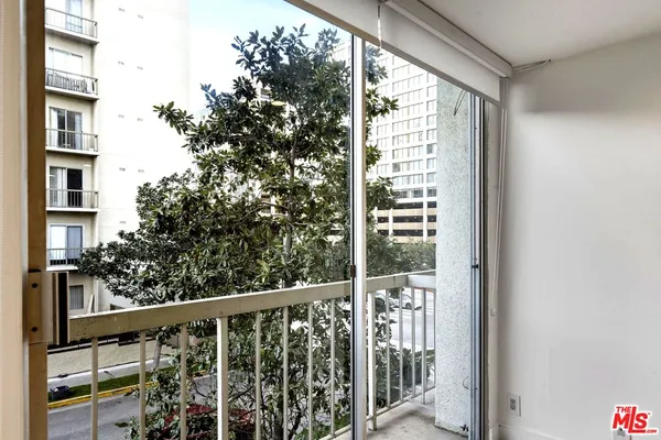 a view of a balcony with an outdoor space
