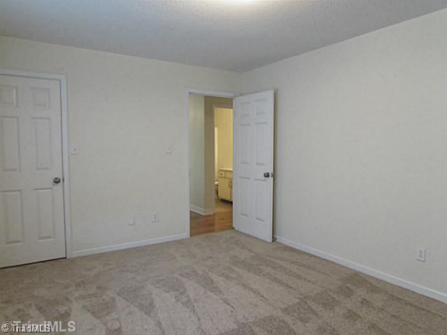 155 Old Mill Road High Point, NC 27265 - Photo 12 of 16 2nd Bedroom. This bedroom is almost as big as the master and has a large walk-in closet and convenient access to 2nd bathroom.