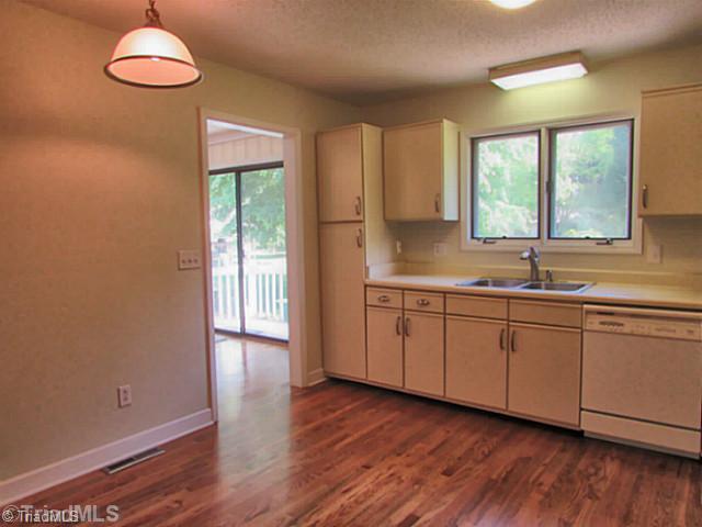 155 Old Mill Road High Point, NC 27265 - Photo 8 of 16 Kitchen. Kitchen sink overlooks lovely back patio area. Large window lets in plenty of sunlight.