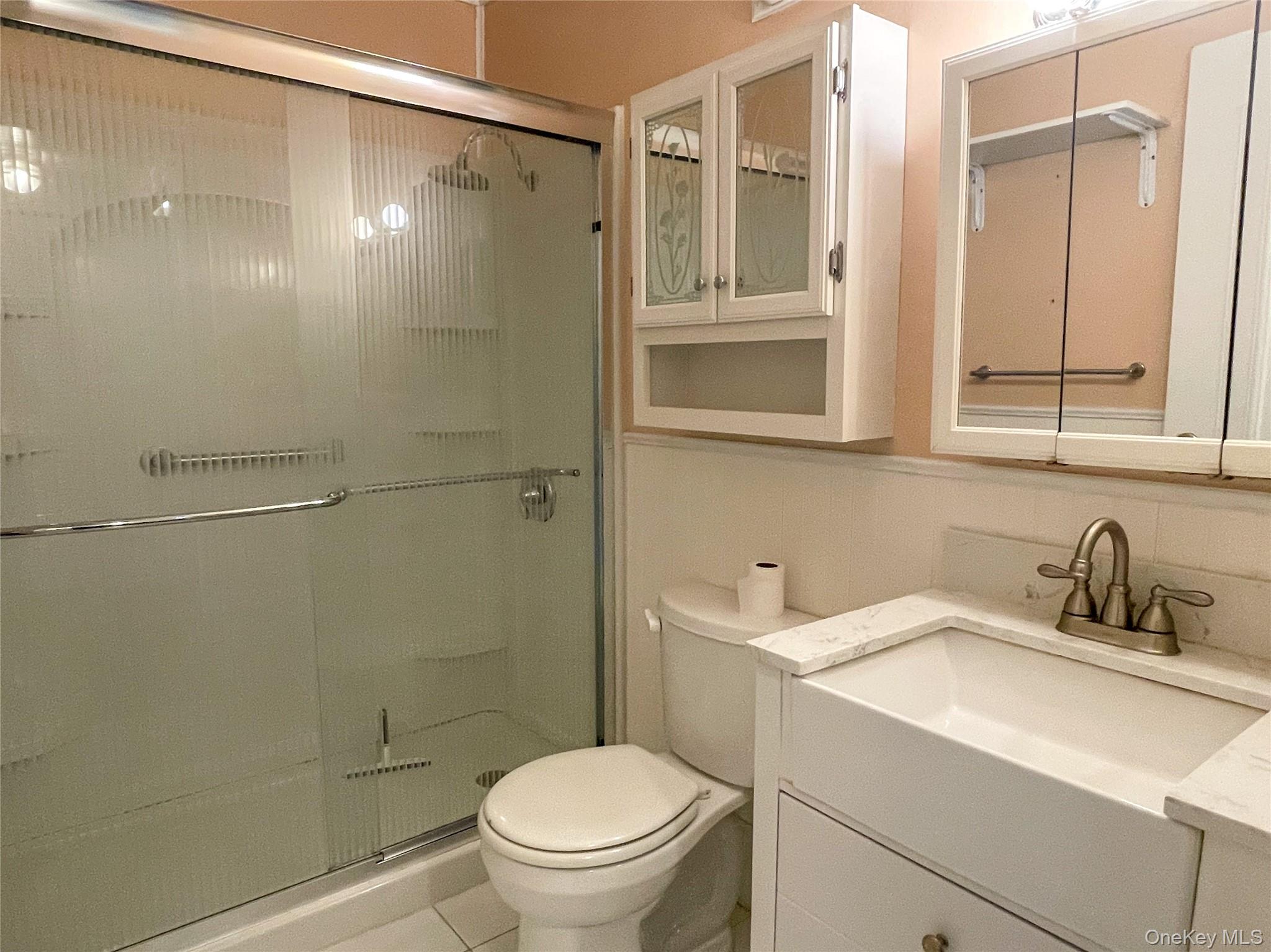 164 Rinaldi Boulevard, Unit B Poughkeepsie, NY 12601 - Photo 11 of 15 a bathroom with a sink toilet and shower