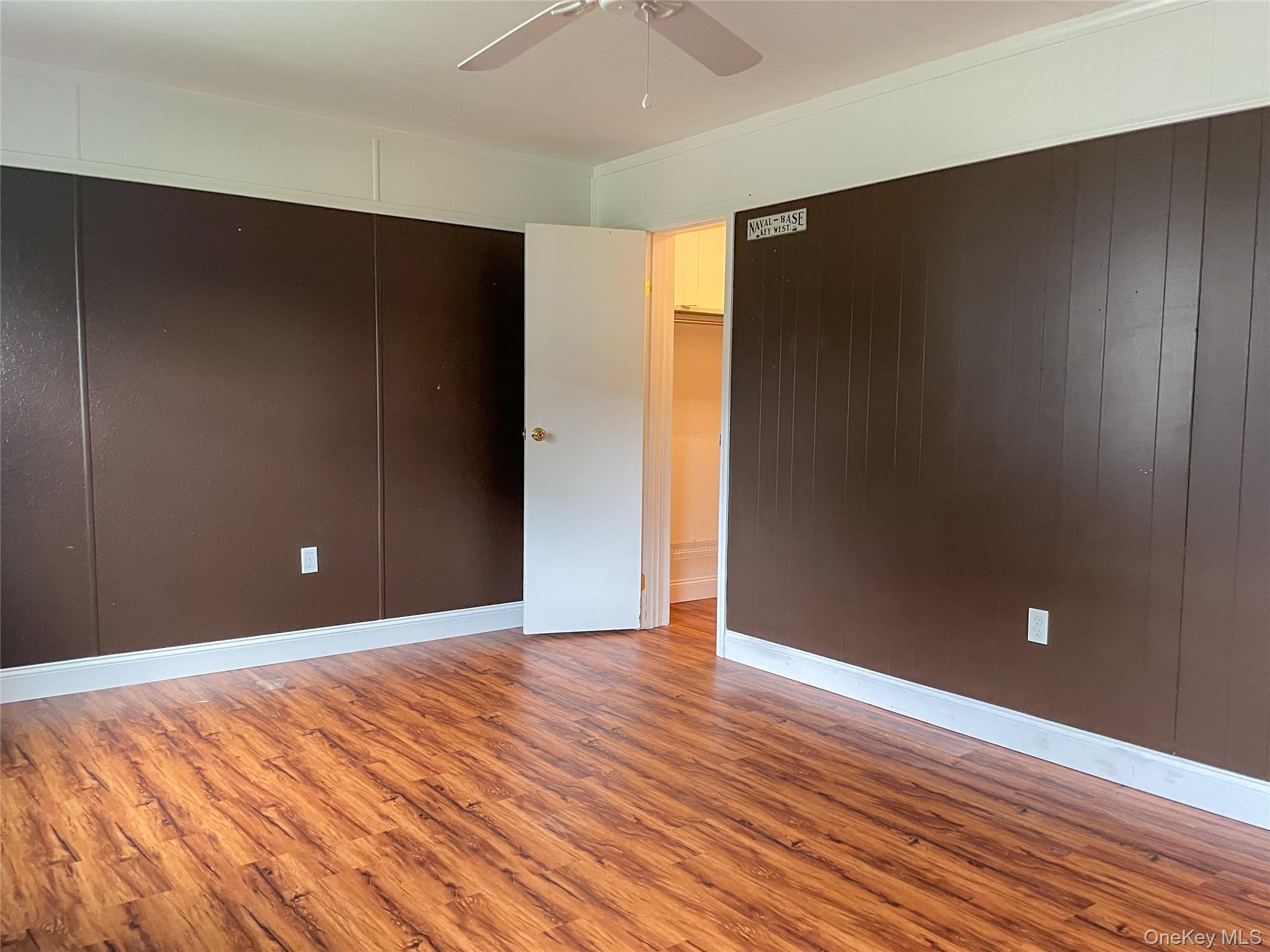 164 Rinaldi Boulevard, Unit B Poughkeepsie, NY 12601 - Photo 13 of 15 a view of an empty room with wooden floor