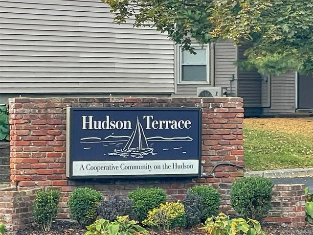 a sign that is on a brick building