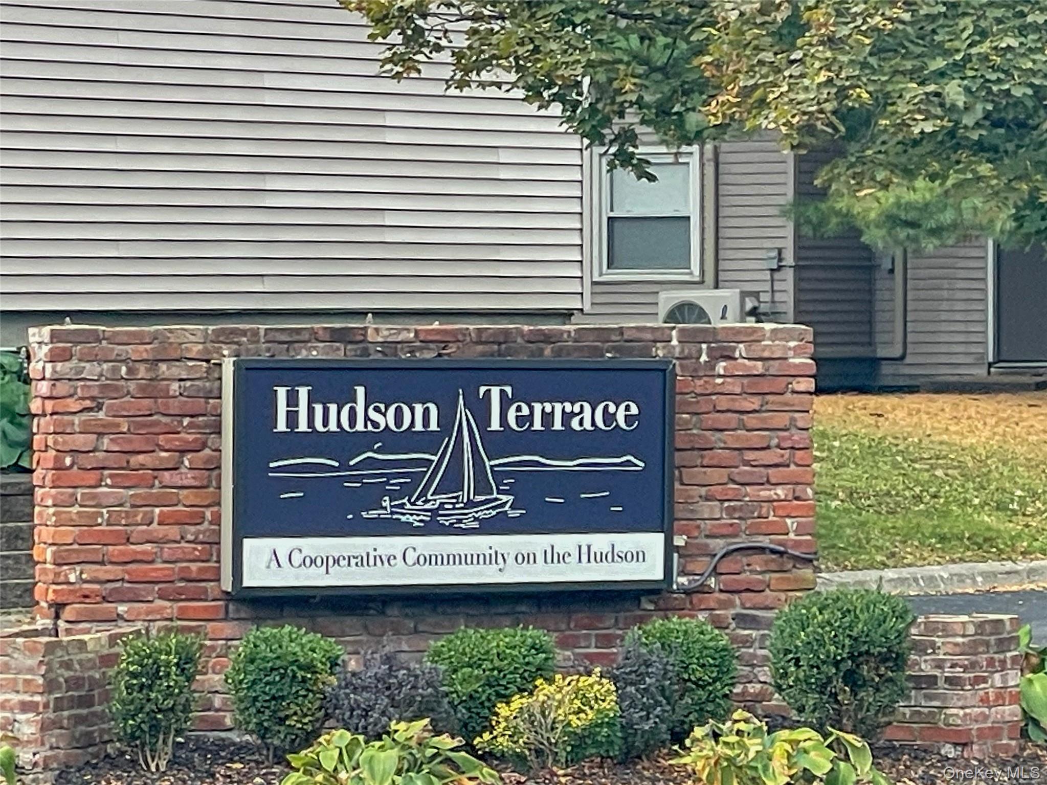 164 Rinaldi Boulevard, Unit B Poughkeepsie, NY 12601 - Photo 15 of 15 a sign that is on a brick building