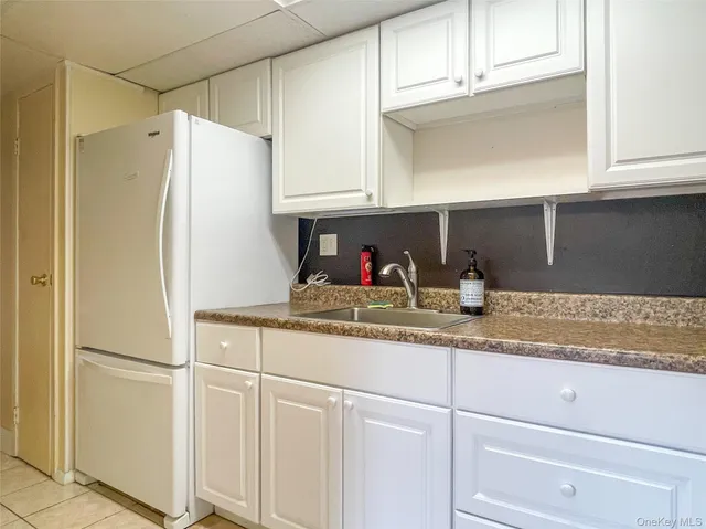 a kitchen with appliances and cabinets