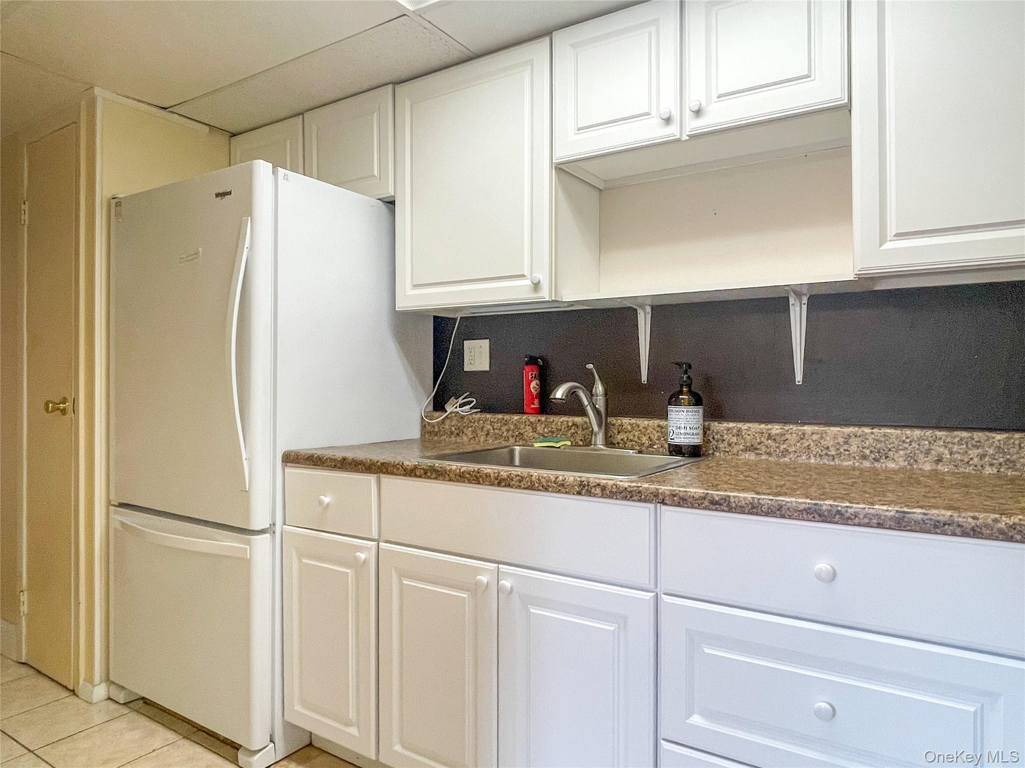 164 Rinaldi Boulevard, Unit B Poughkeepsie, NY 12601 - Photo 5 of 15 a kitchen with appliances and cabinets