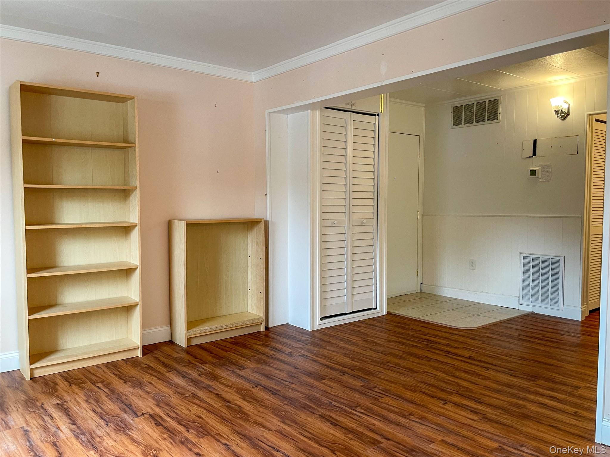 164 Rinaldi Boulevard, Unit B Poughkeepsie, NY 12601 - Photo 9 of 15 a view of an empty room with wooden floor and a window