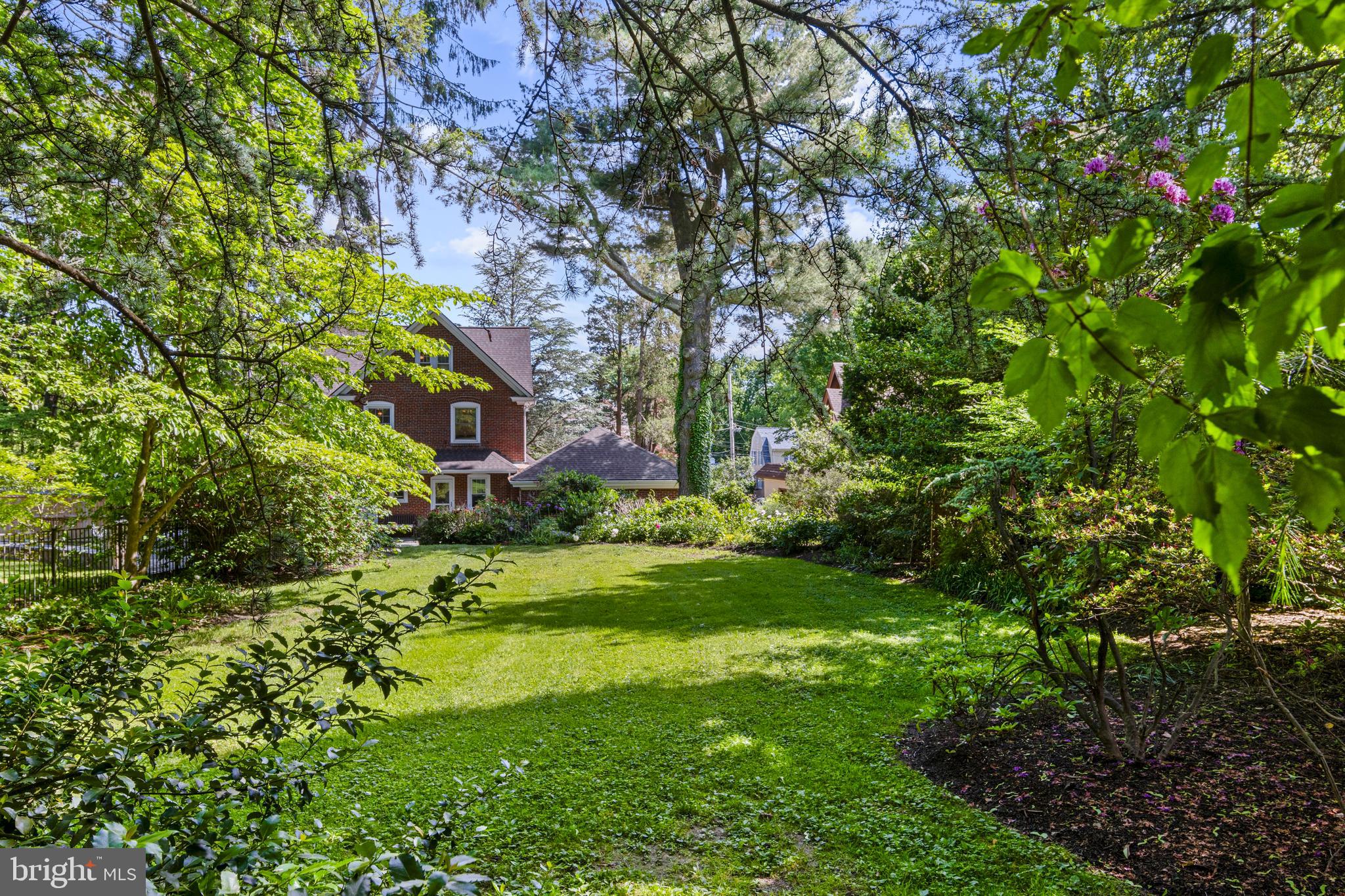 416 Waverly Road Wyncote, PA 19095 - Photo 54 of 67 a view of a big yard with plants and large trees