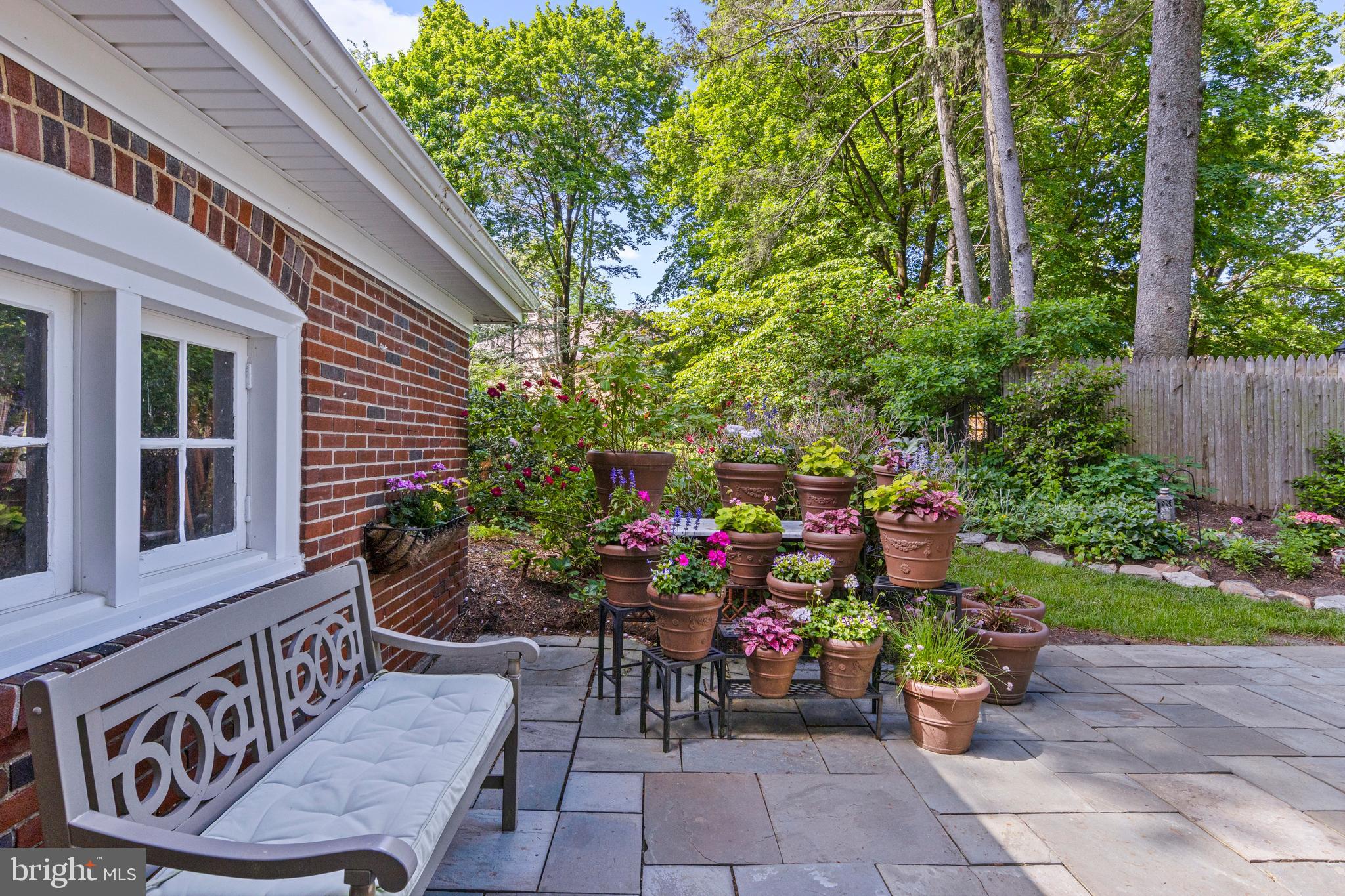 416 Waverly Road Wyncote, PA 19095 - Photo 58 of 67 a view of a chairs and table in the back yard of the house