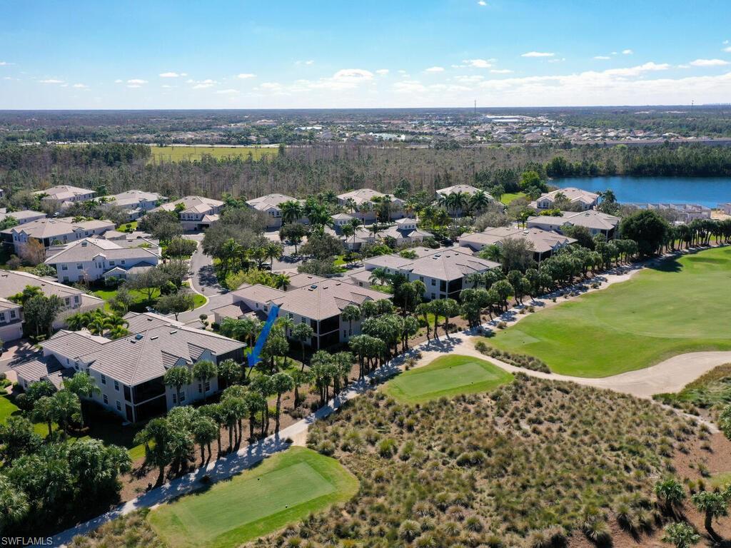 10540 Marino Pointe Drive, Unit 301 Miromar Lakes, FL 33913 - Photo 2 of 43 a view of a city