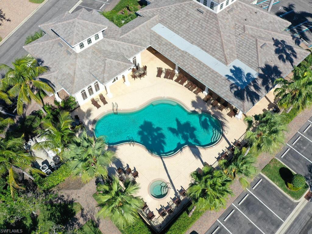 10540 Marino Pointe Drive, Unit 301 Miromar Lakes, FL 33913 - Photo 27 of 43 an aerial view of a house with a yard and garden