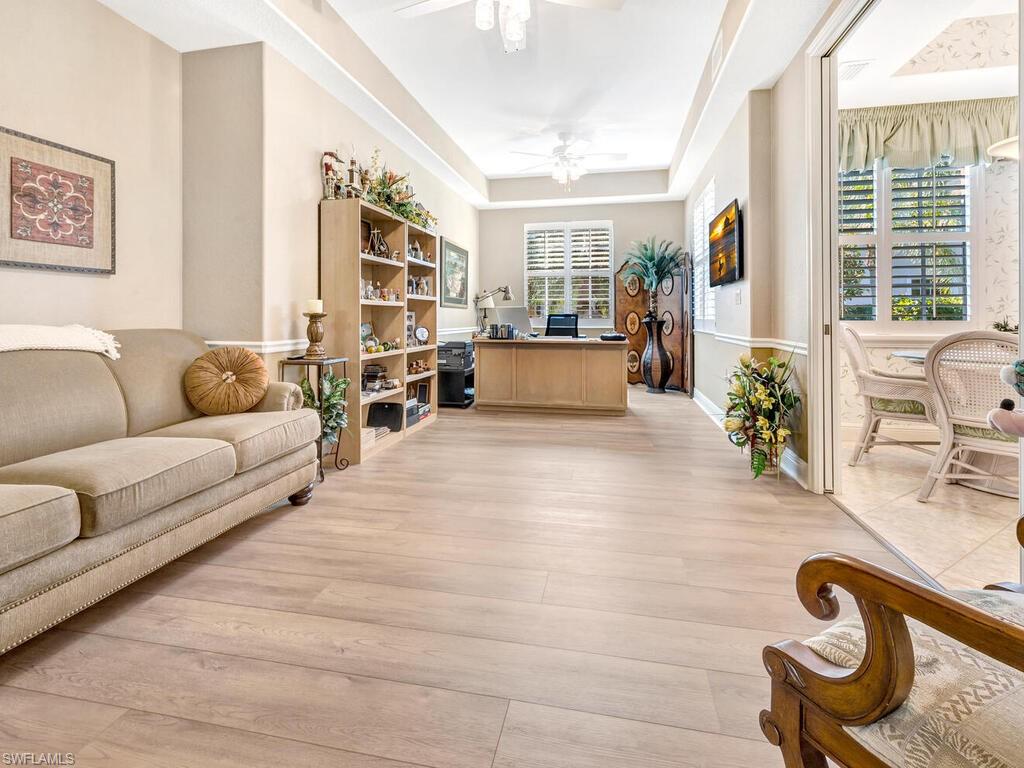 10540 Marino Pointe Drive, Unit 301 Miromar Lakes, FL 33913 - Photo 4 of 43 a living room with furniture