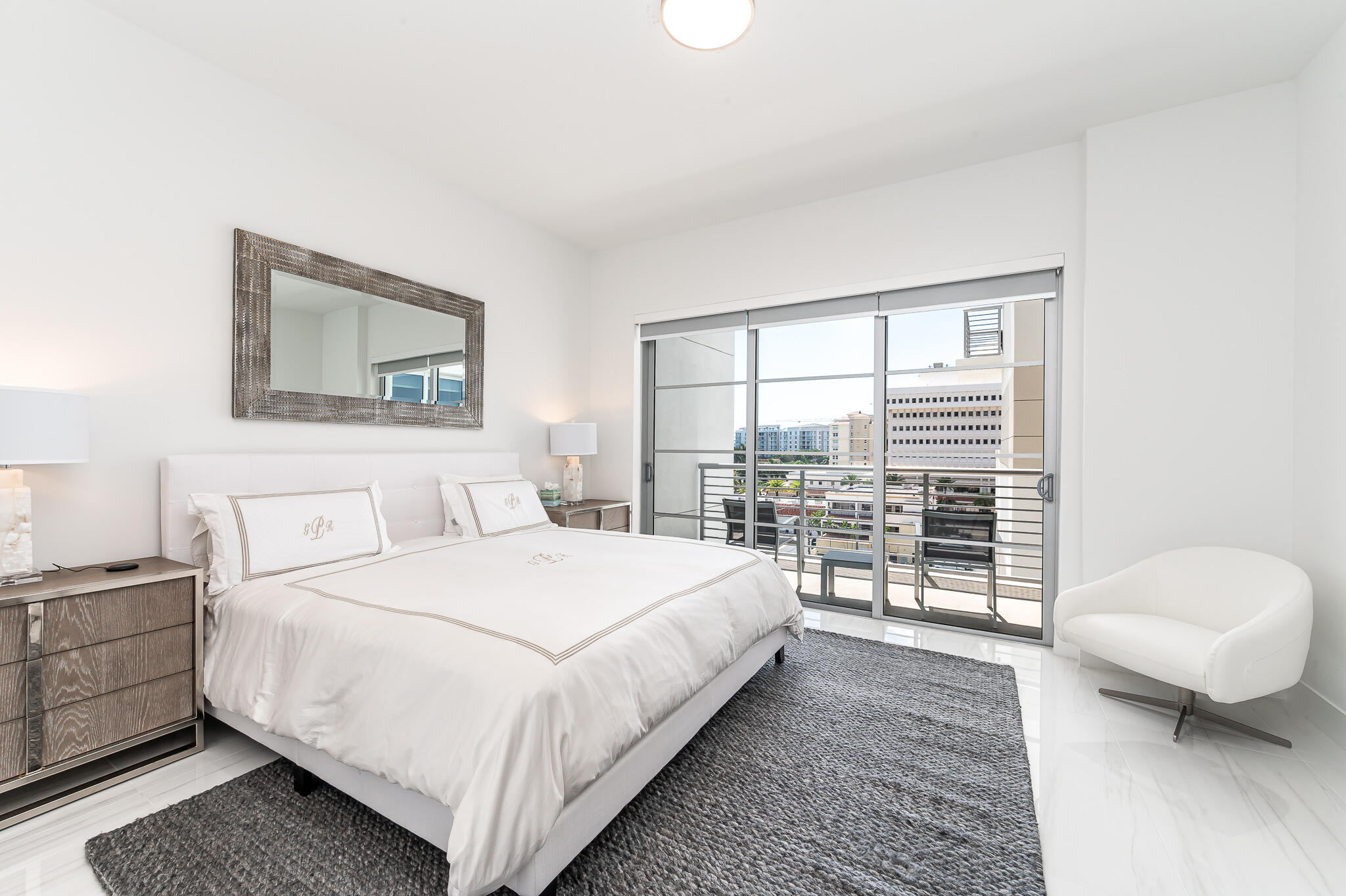 155 East Boca Raton Road, Unit 614 Boca Raton, FL 33432 - Photo 15 of 55 a bedroom with a large bed and a couch