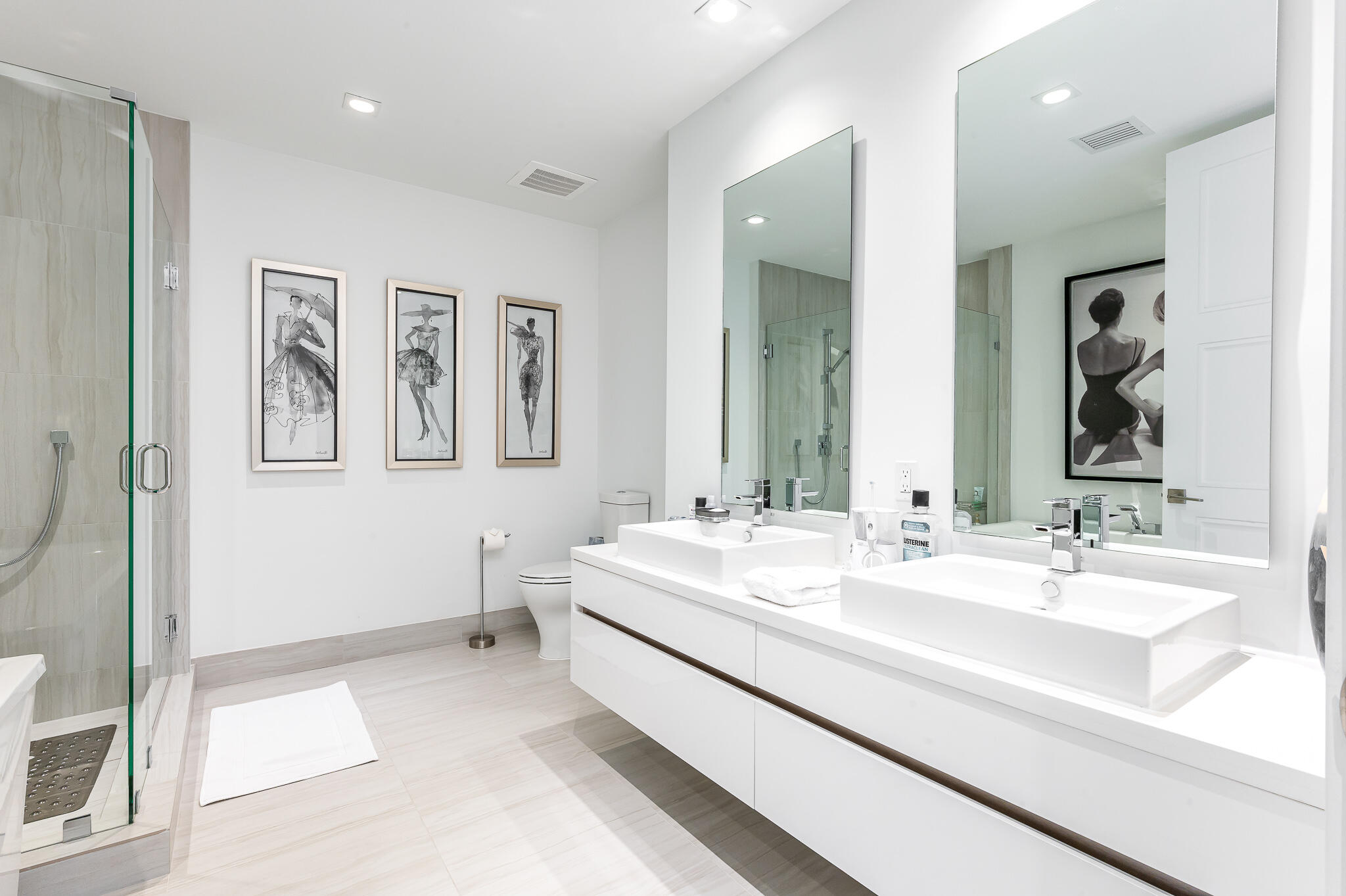 155 East Boca Raton Road, Unit 614 Boca Raton, FL 33432 - Photo 19 of 55 a en suite bathroom with a double vanity sink and a mirror