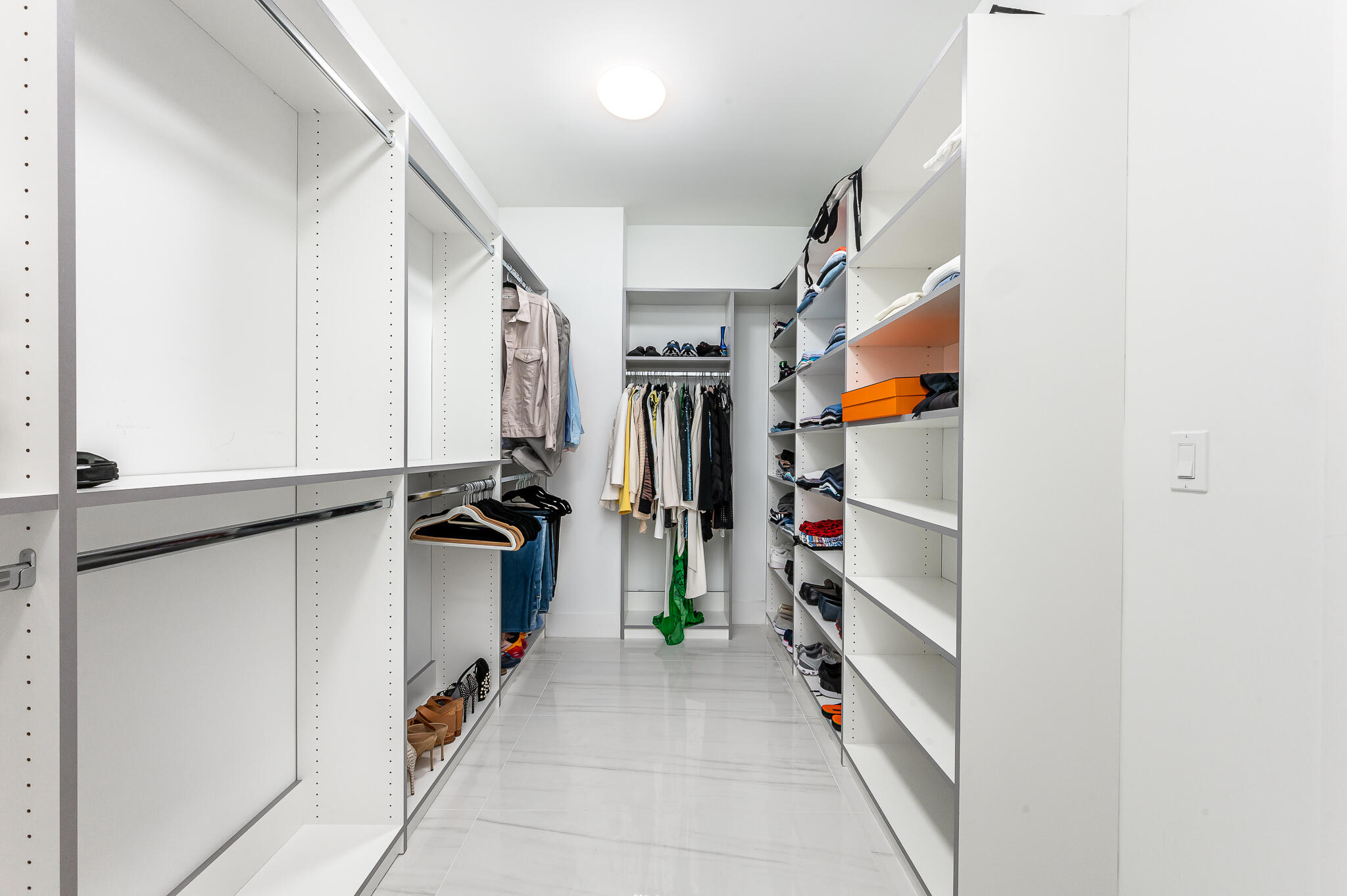 155 East Boca Raton Road, Unit 614 Boca Raton, FL 33432 - Photo 22 of 55 a view of walk in closet with clothes and shoes