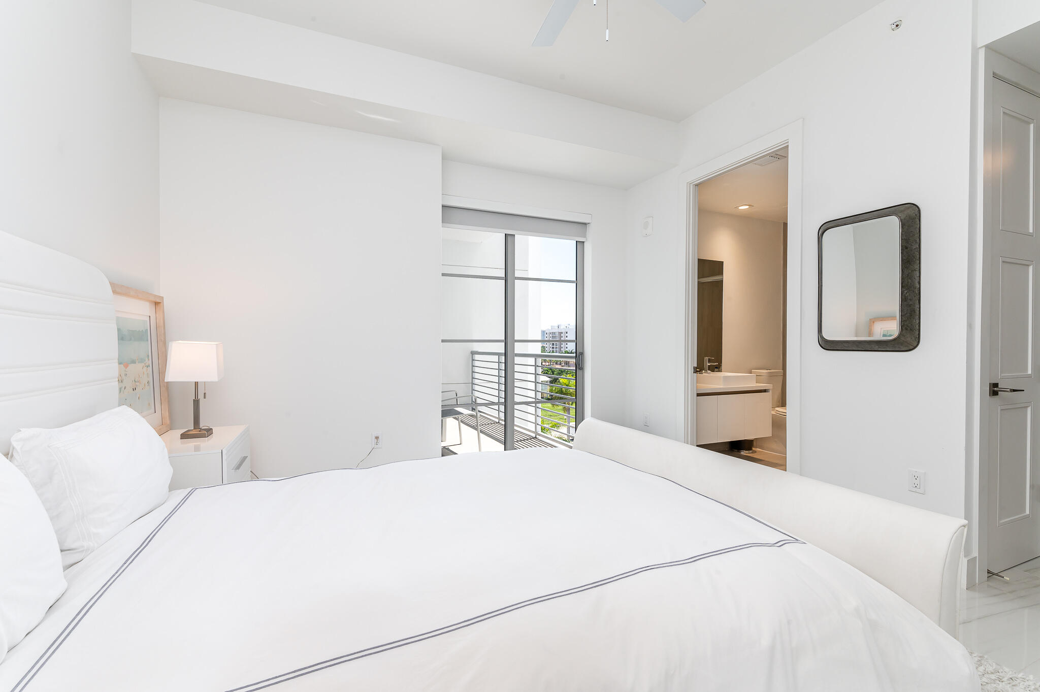 155 East Boca Raton Road, Unit 614 Boca Raton, FL 33432 - Photo 24 of 55 a bedroom with a large bed and a window