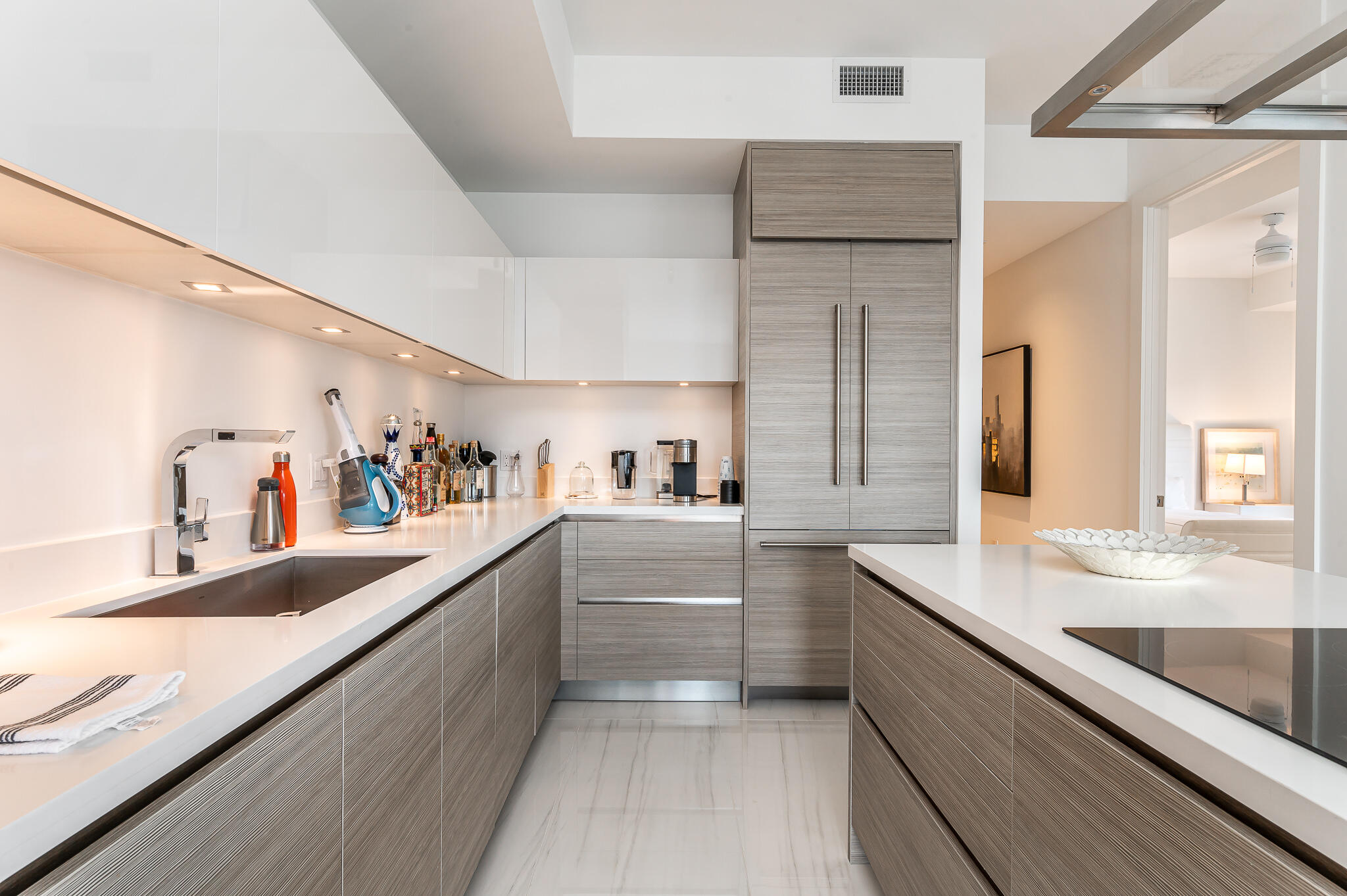 155 East Boca Raton Road, Unit 614 Boca Raton, FL 33432 - Photo 3 of 55 a large kitchen with kitchen island a sink stainless steel appliances and cabinets