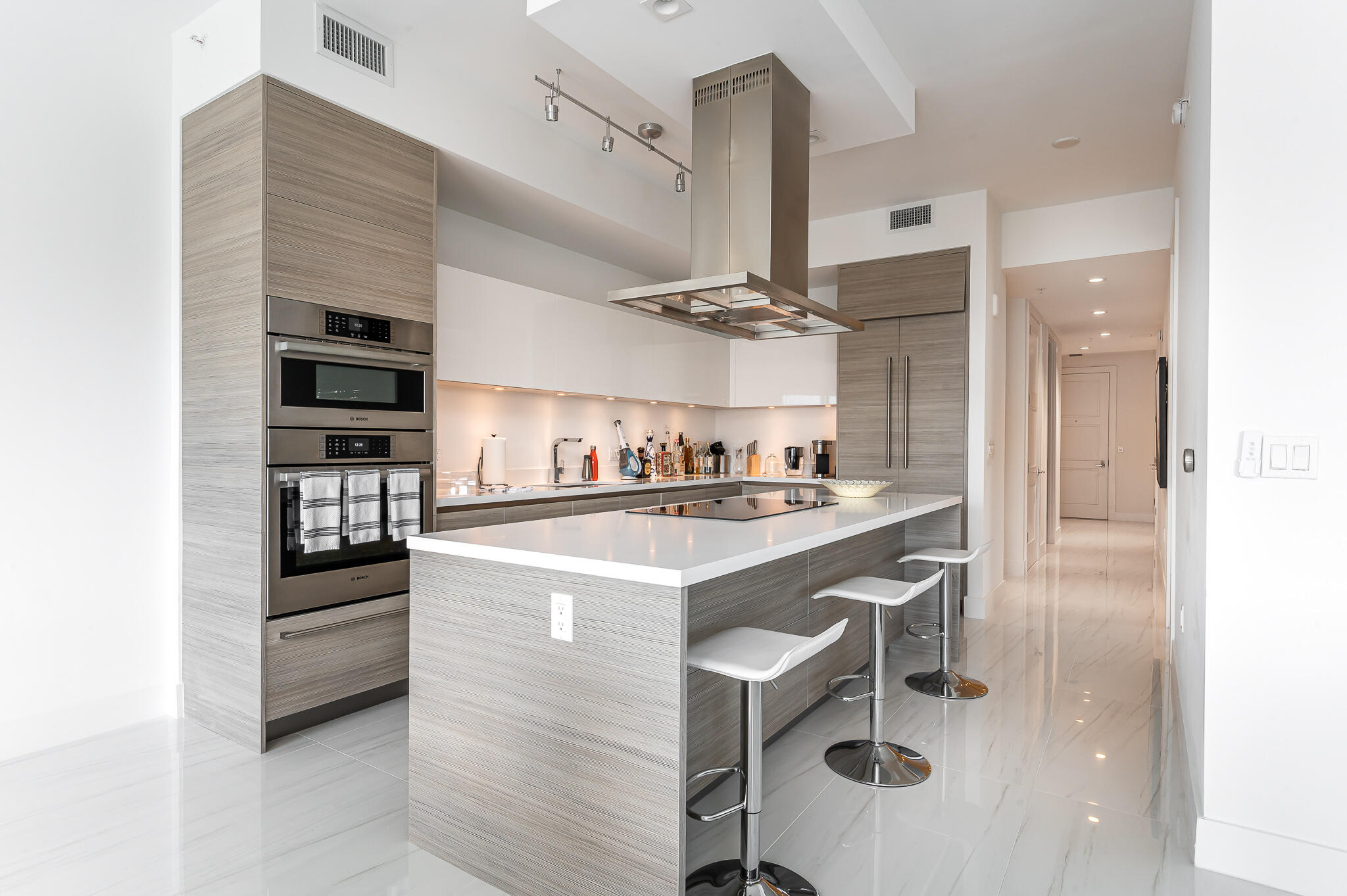 155 East Boca Raton Road, Unit 614 Boca Raton, FL 33432 - Photo 4 of 55 a kitchen with kitchen island stainless steel appliances a sink and cabinets