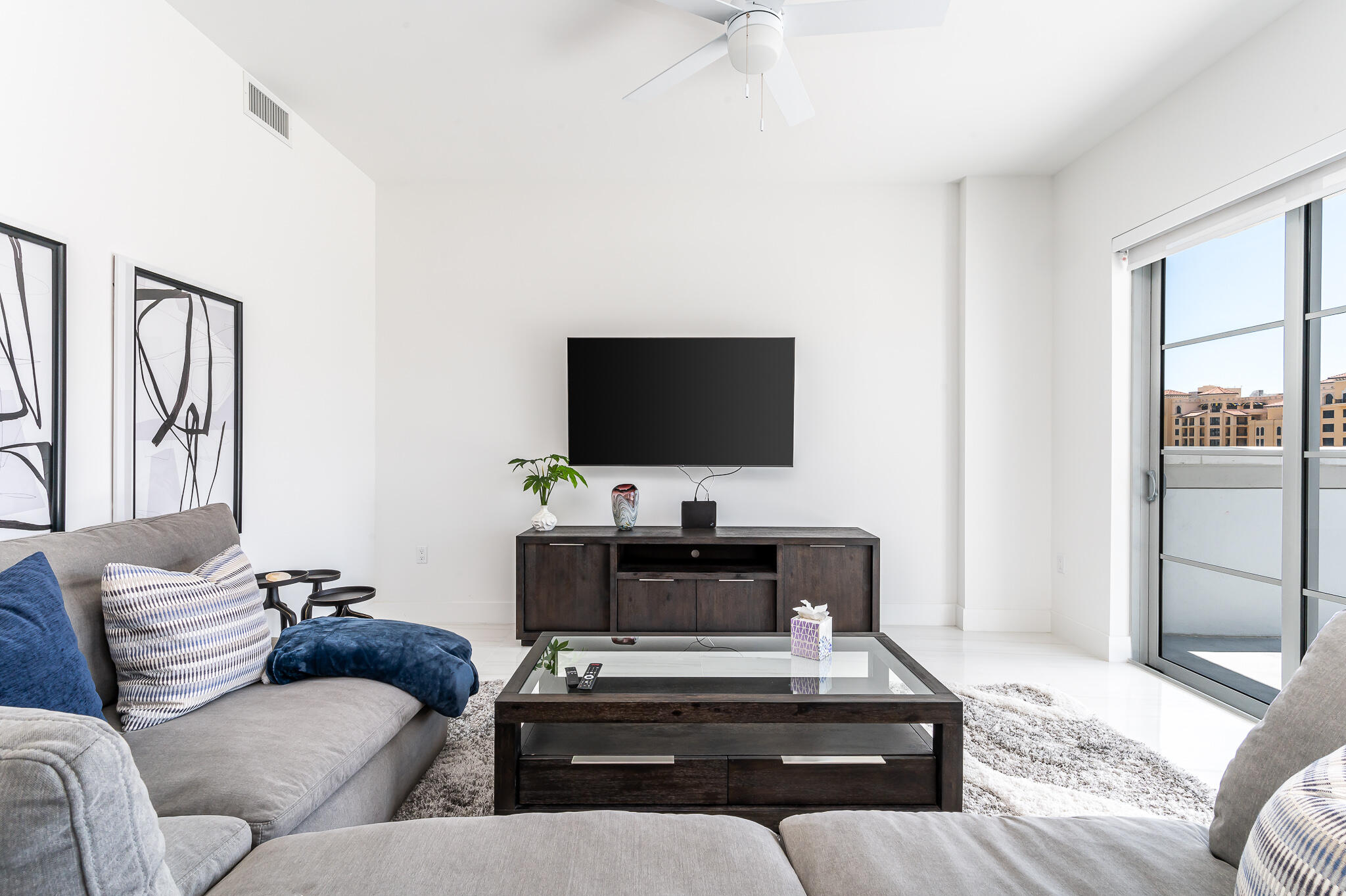 155 East Boca Raton Road, Unit 614 Boca Raton, FL 33432 - Photo 7 of 55 a living room with furniture and a flat screen tv