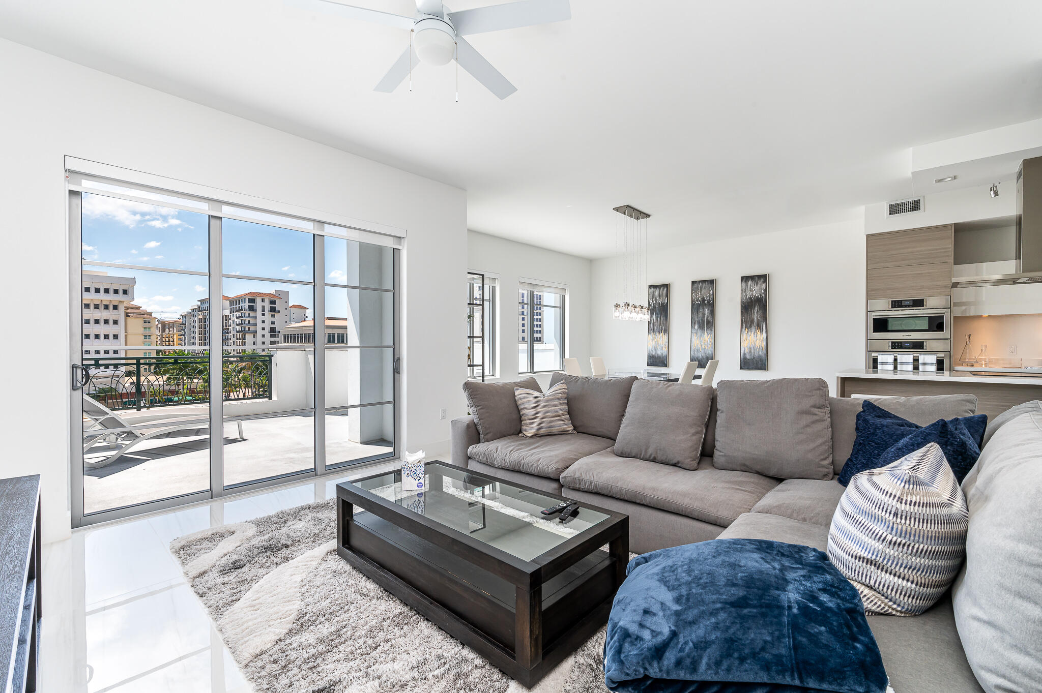 155 East Boca Raton Road, Unit 614 Boca Raton, FL 33432 - Photo 8 of 55 a living room with furniture and a large window