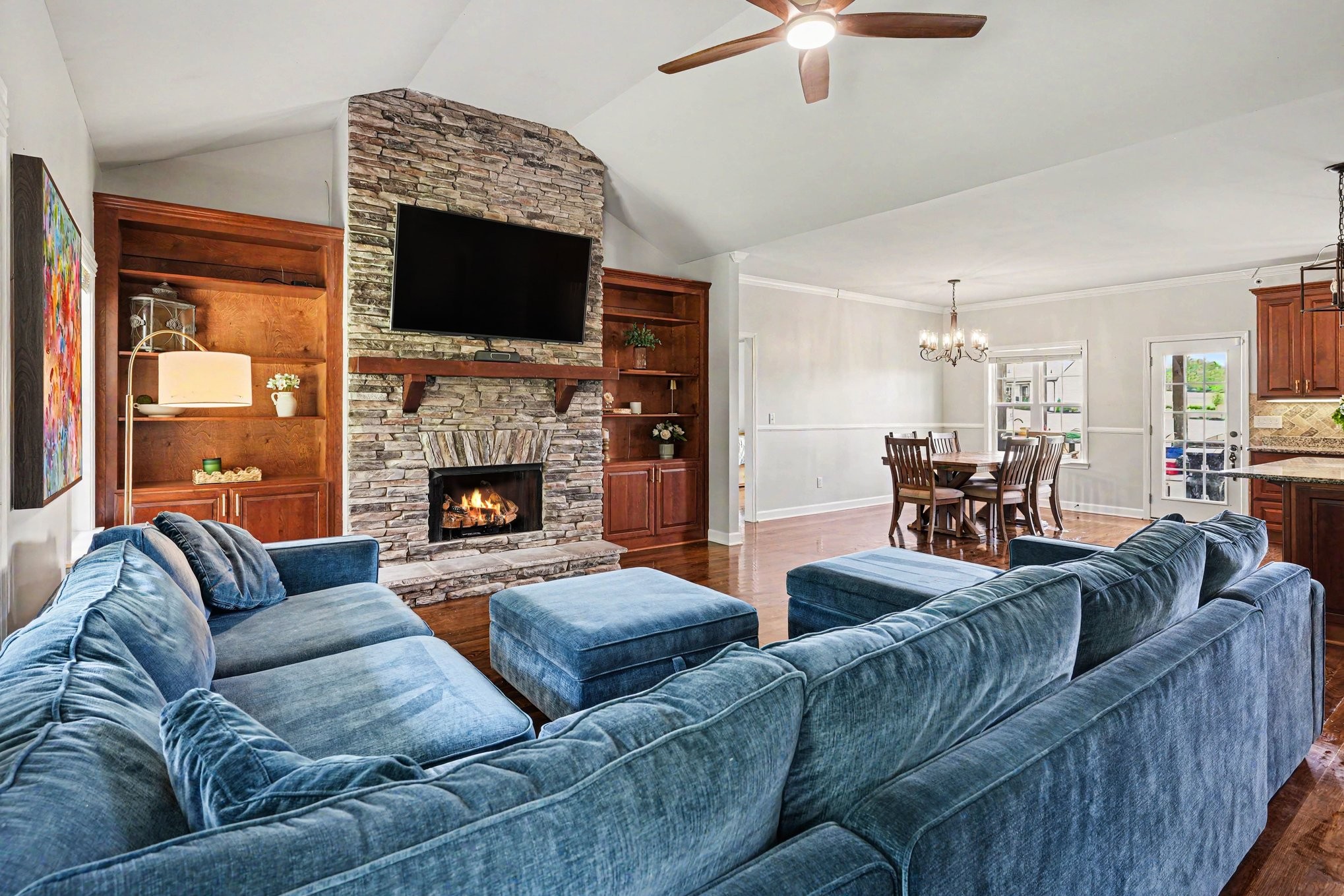 948 Goslin Branch Road Burns, TN 37029 - Photo 5 of 37 a living room with furniture fireplace and flat screen tv