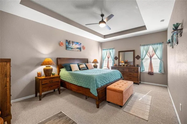 a bedroom with a bed couch and window