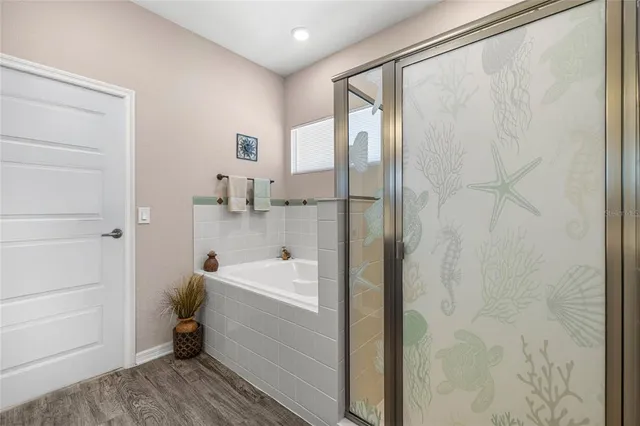 a bathroom with a bathtub and sink