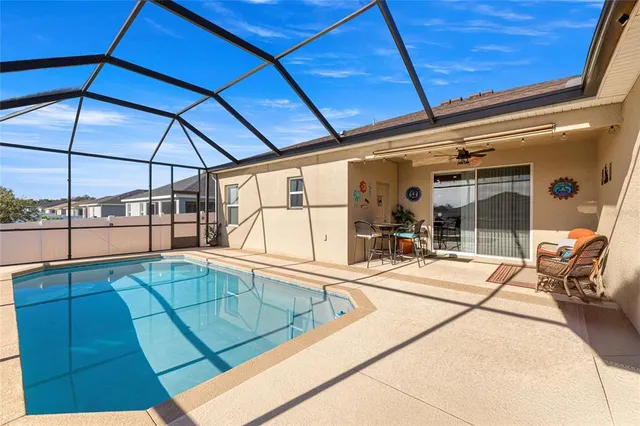a view of a patio with a table and chairs