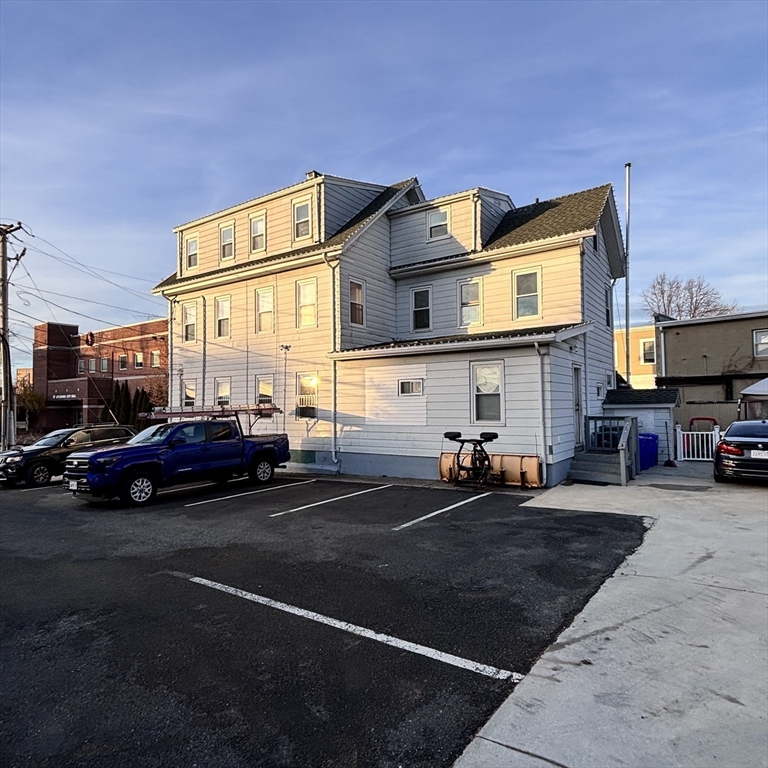12 Pine Street, Unit 2 Attleboro, MA 02703 - Photo 19 of 20 a cars parked in front of a building