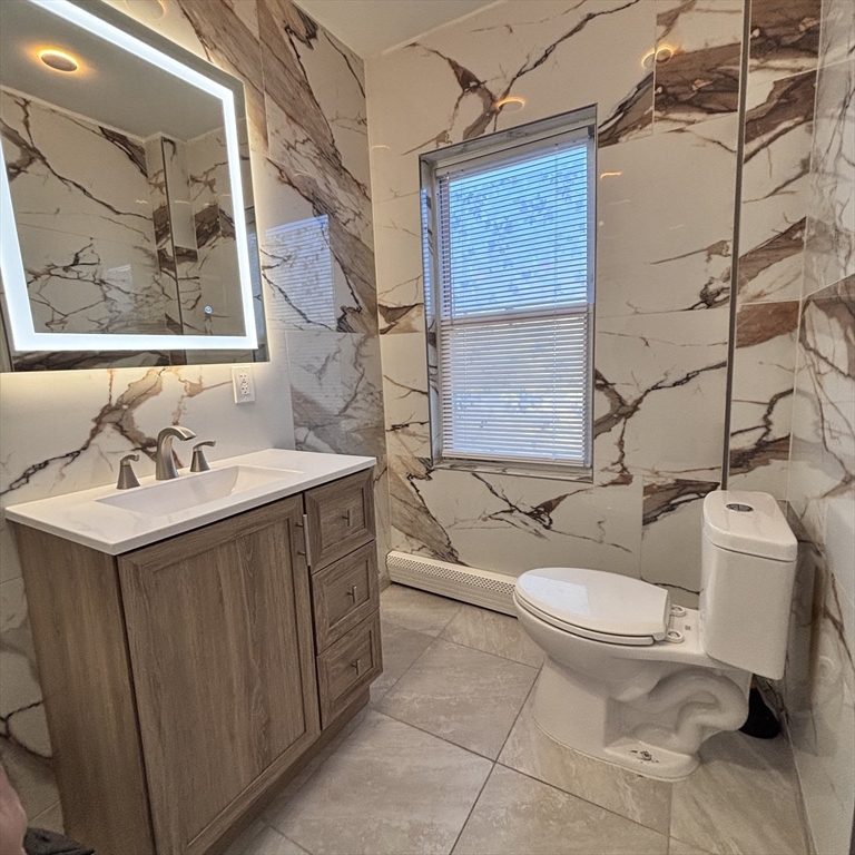 12 Pine Street, Unit 2 Attleboro, MA 02703 - Photo 3 of 20 a bathroom with a sink toilet and shower