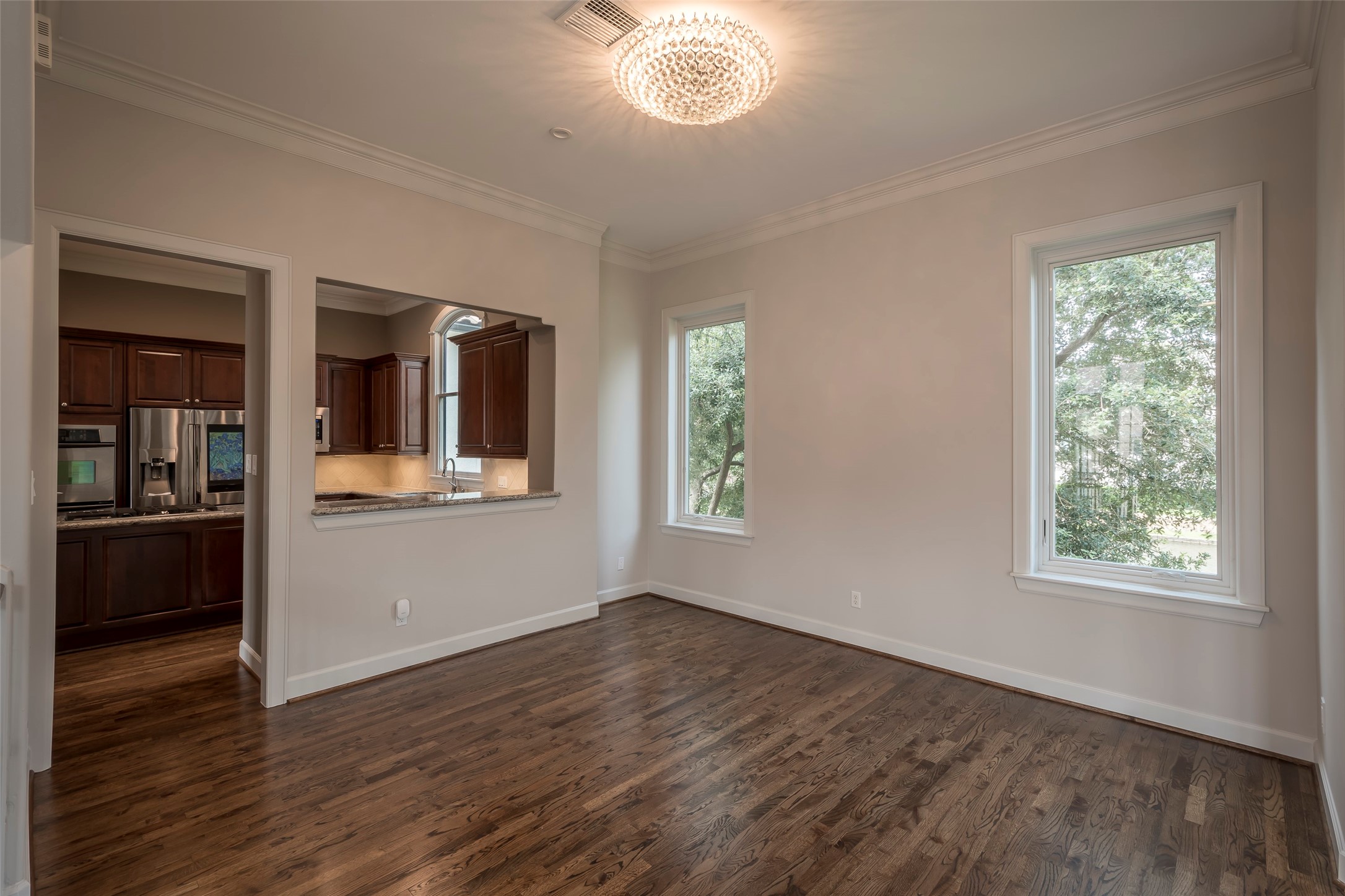 6334 Mystic Bridge Drive Houston, TX 77021 - Photo 17 of 47 an empty room with wooden floor and windows