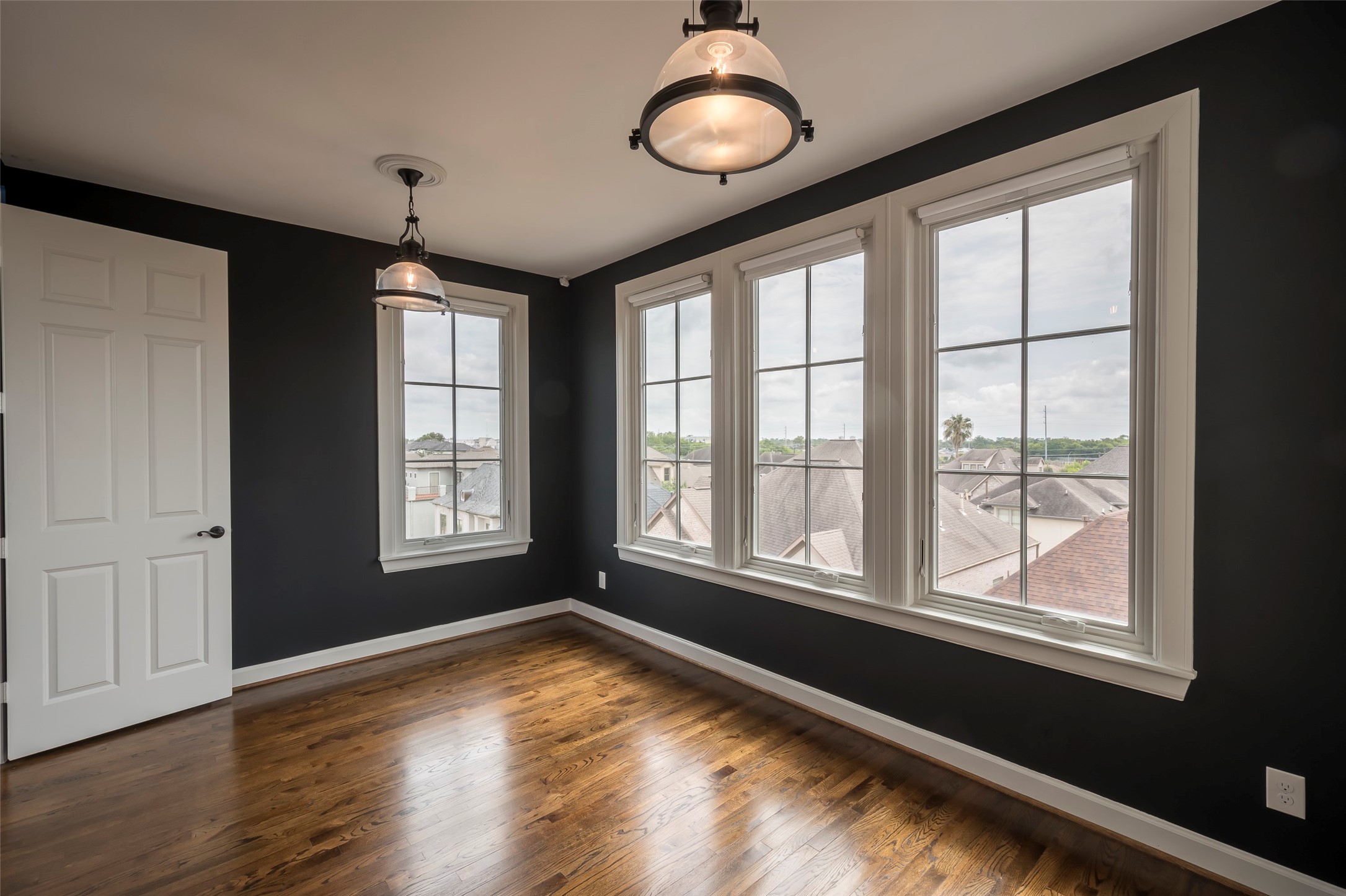 6334 Mystic Bridge Drive Houston, TX 77021 - Photo 39 of 47 a view of an empty room with wooden floor and a window