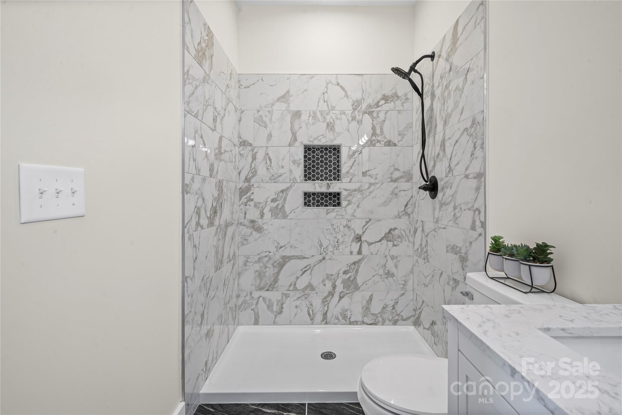 241 Booker Drive Southwest Concord, NC 28025 - Photo 16 of 29 a bathroom with a toilet and a shower