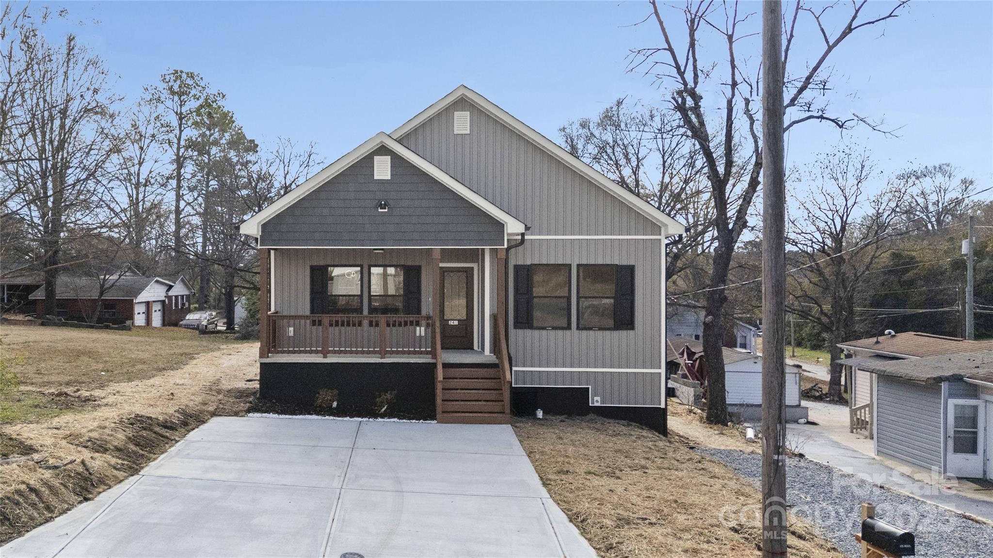 241 Booker Drive Southwest Concord, NC 28025 - Photo 29 of 29 a front view of a house with a yard