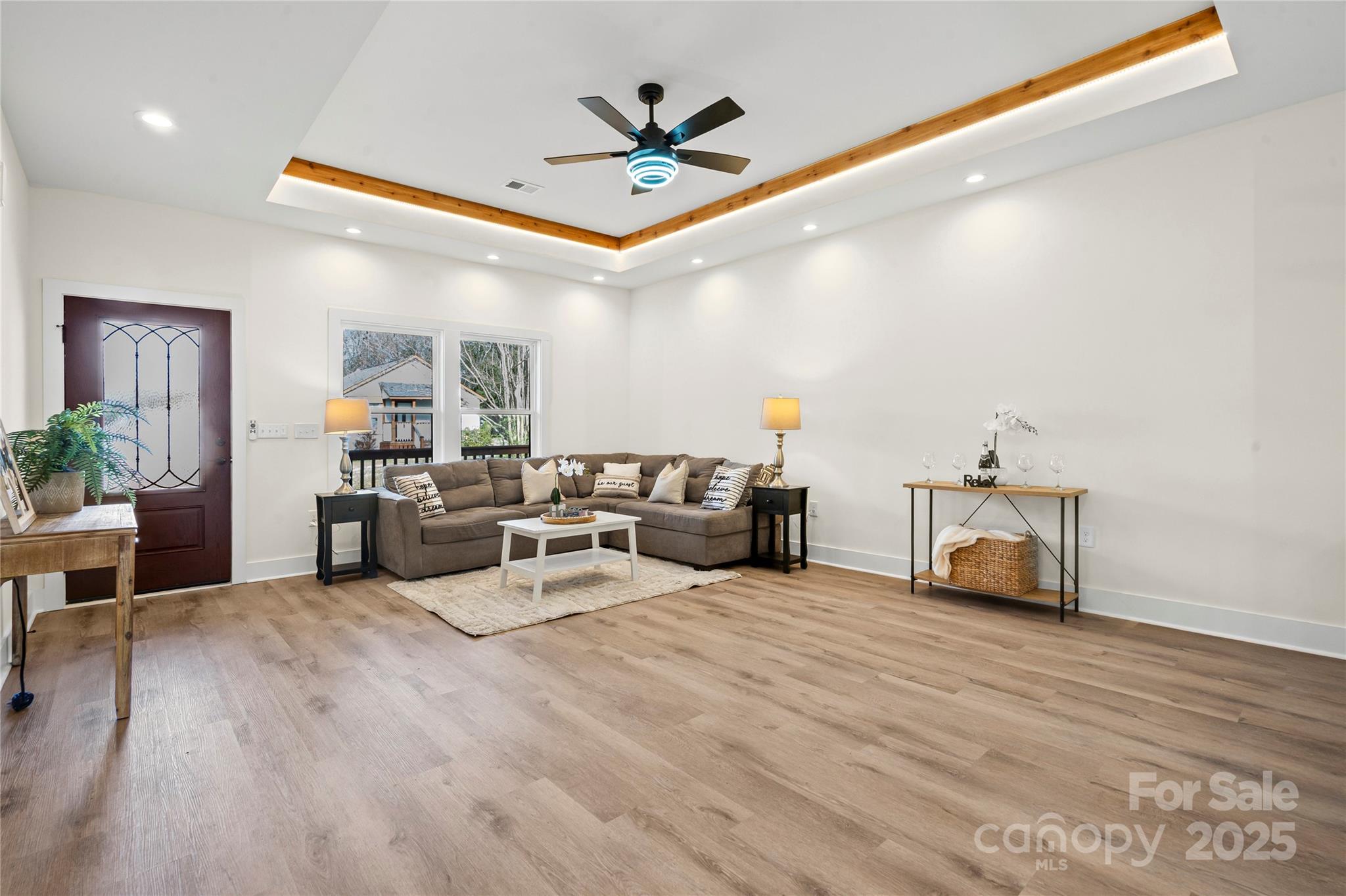 241 Booker Drive Southwest Concord, NC 28025 - Photo 4 of 29 a living room with furniture and kitchen view
