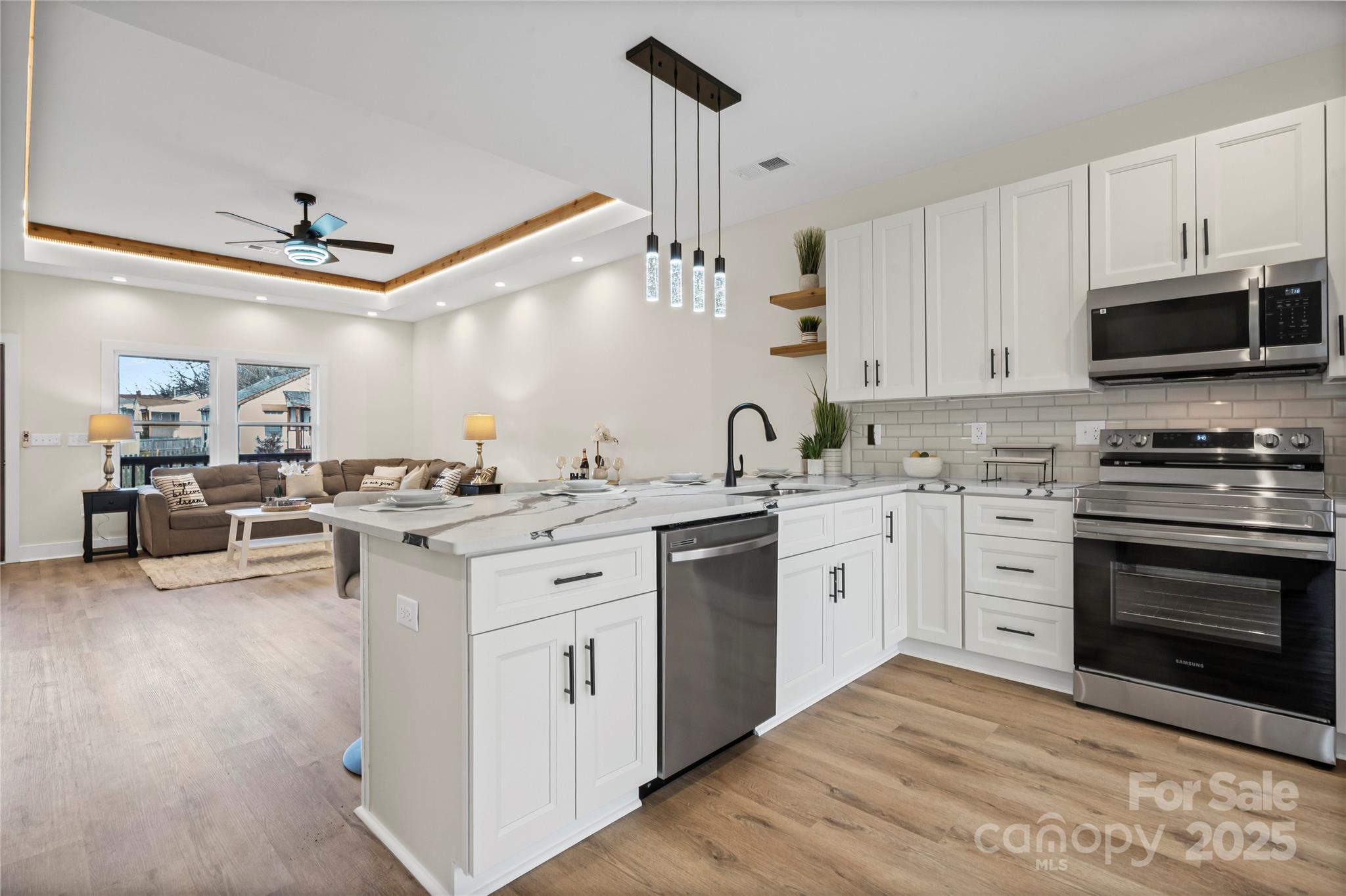 241 Booker Drive Southwest Concord, NC 28025 - Photo 7 of 29 a kitchen with a sink stove and cabinets