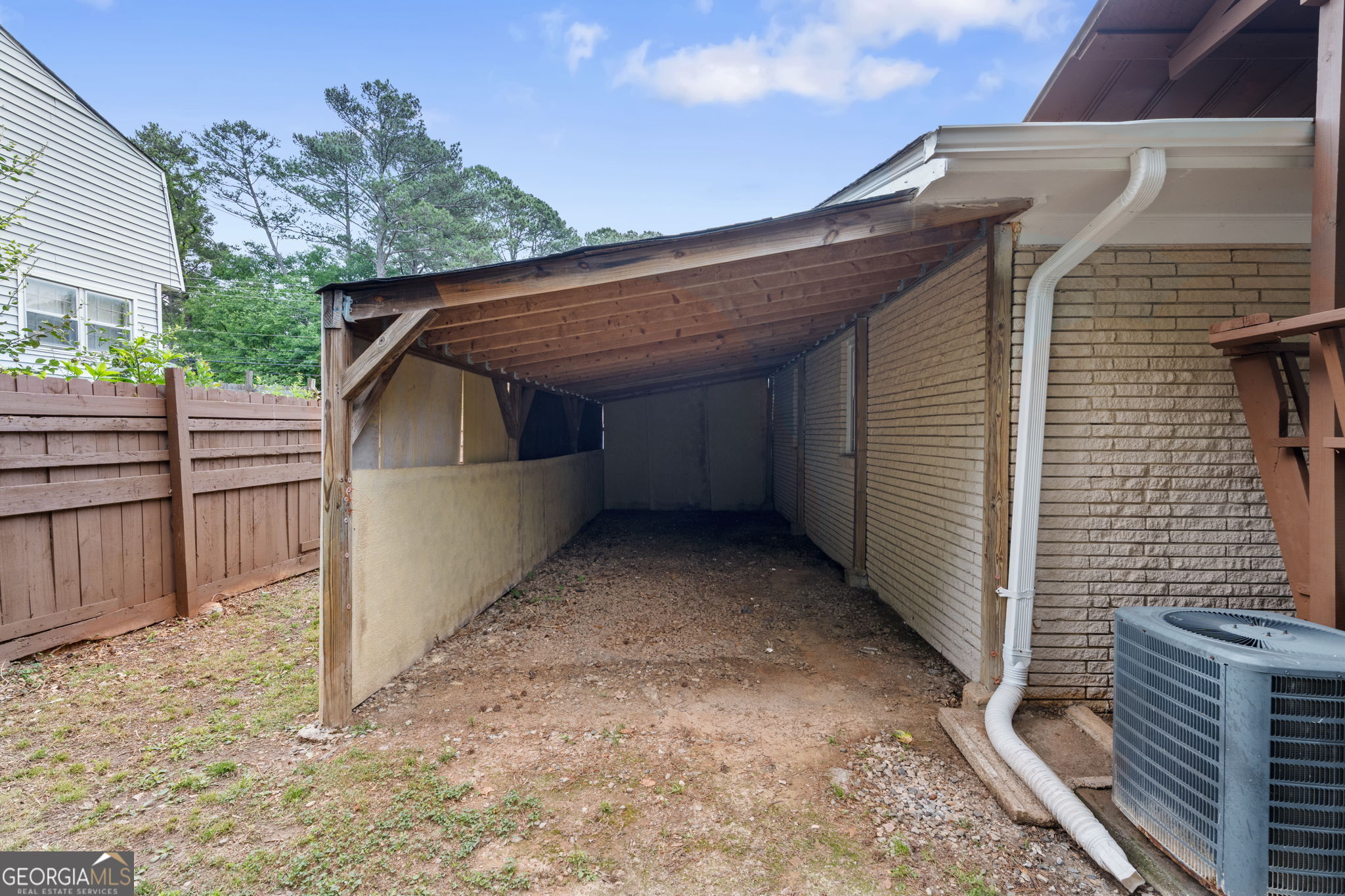 6463 Maddox Road Morrow, GA 30260 - Photo 35 of 46 a view of backyard of wooden fence and large trees